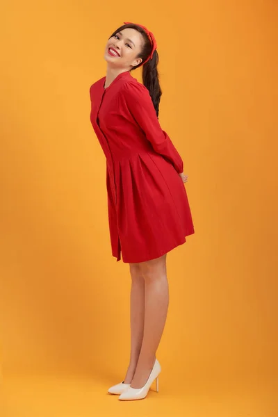 Hermosa Chica Encantadora Vestido Rojo Aislado Sobre Fondo Naranja Cuerpo —  Fotos de Stock