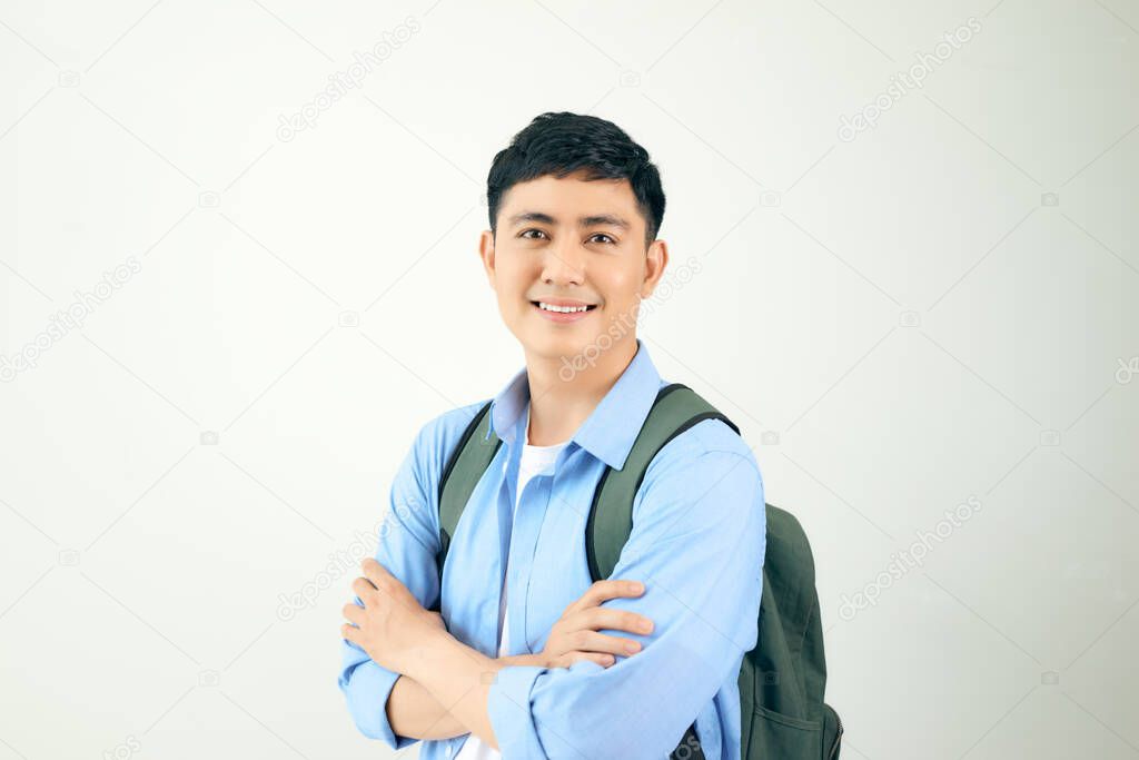 Handsome and friendly face man self-confident positive expression with crossed arms on white background 
