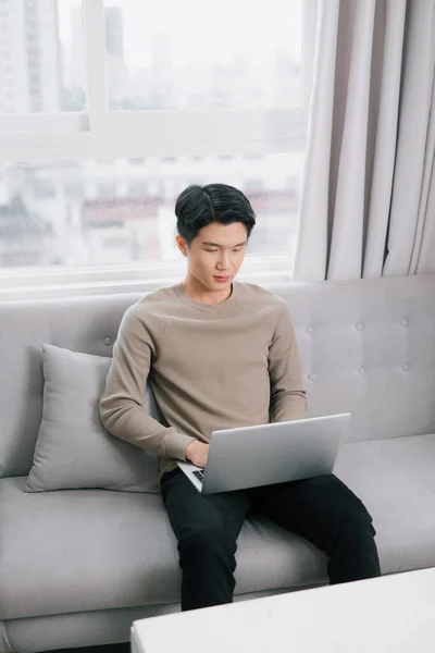 Young Attractive Smiling Guy Browsing His Laptop Sitting Home Cozy — Stock Photo, Image