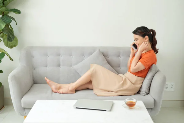 Casual Young Woman Using Laptop Cellphone Sofa Home — Stock Photo, Image