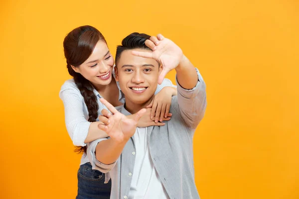 Happy Young Asian Couple Looking Finger Frame Smiling While Standing — Stock Photo, Image