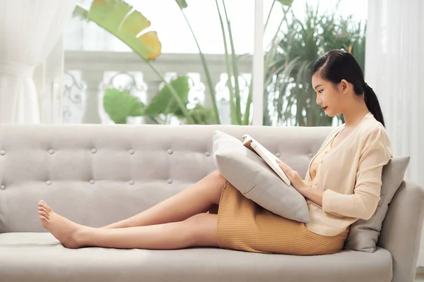 Happy Asian Girl Resting Sofa Living Room While Reading Her — Stock Photo, Image