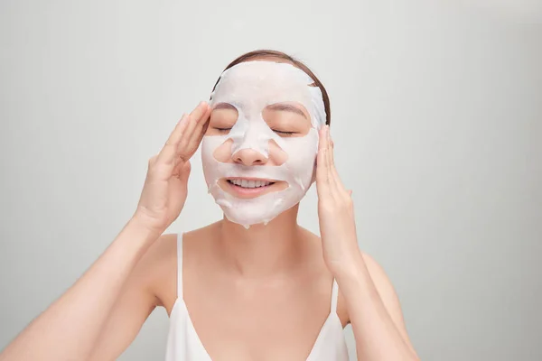 Happy Young Asian Woman Using Cosmetic Mask Isolated White Background — Stok Foto