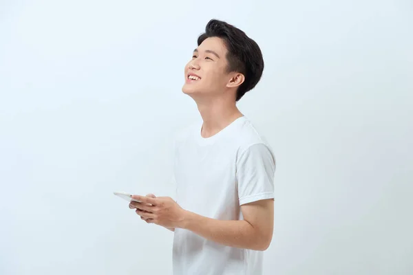 Smiling Young Good Looking Asian Man Using Smartphone — Stock Photo, Image