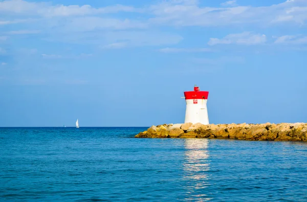 Lighthouse Located Rocks Breakwater Reflected Water Beautiful Sunny Seascape Blue — Stock Photo, Image