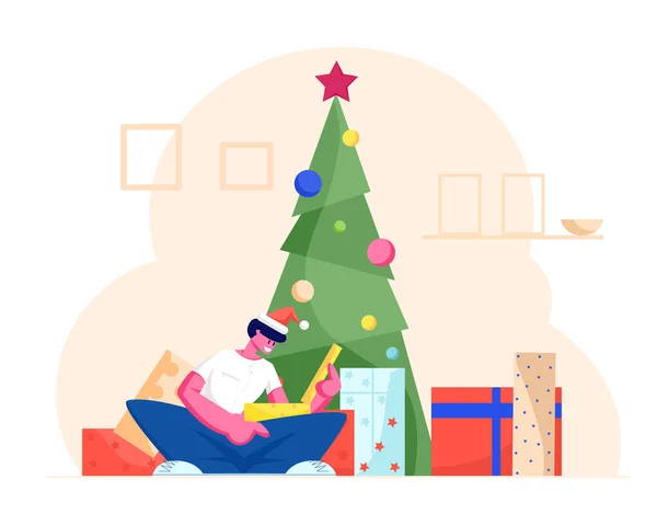 Aufgeregt sitzt ein Mann mit Weihnachtsmann-Hut unter dem geschmückten Weihnachtsbaum und öffnet die Geschenkbox. Winter festliche Jahreszeit Tradition der Bescherung, Cartoon flache Vektorillustration — Stockvektor