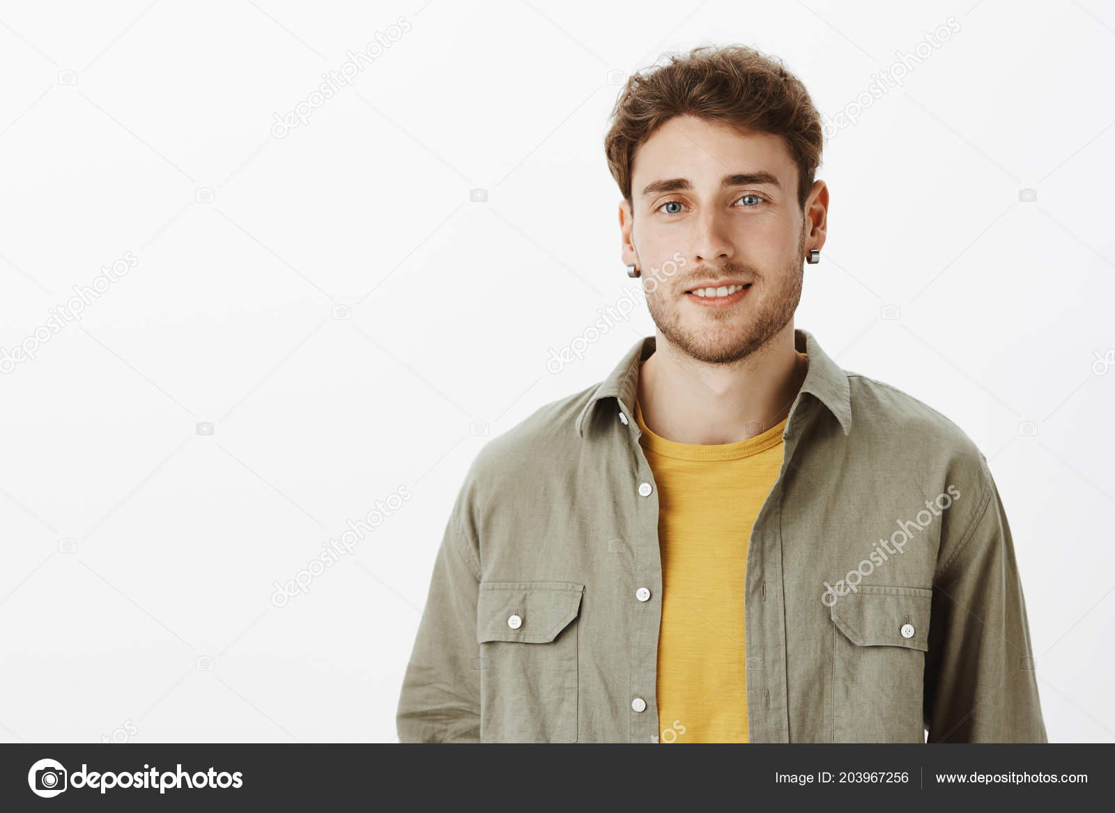 Horizontal Shot Of Confident Flirty Handsome Male With Beard And