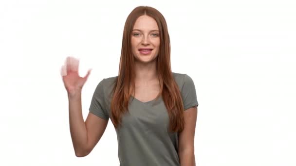 Portrait Of Pretty Redhead Woman 20s Smiling And Greeting Person With Waving Hand Isolated Over
