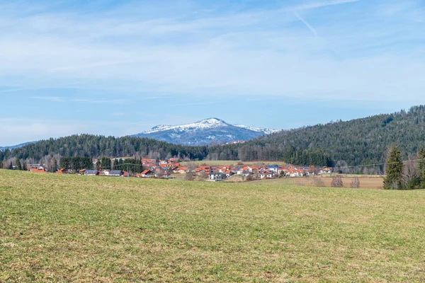 View of the snow-covered mountain Rachel in the Bavarian Forest in spring, Germany