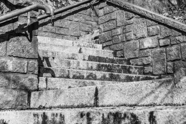 Black white image of stone stairs in a park from top to bottom, Germany