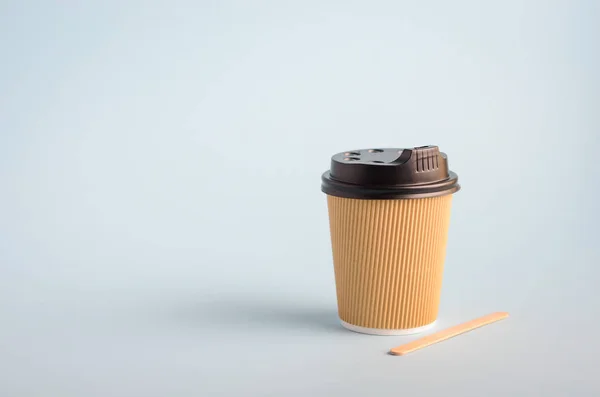 Take away coffee on blue background.