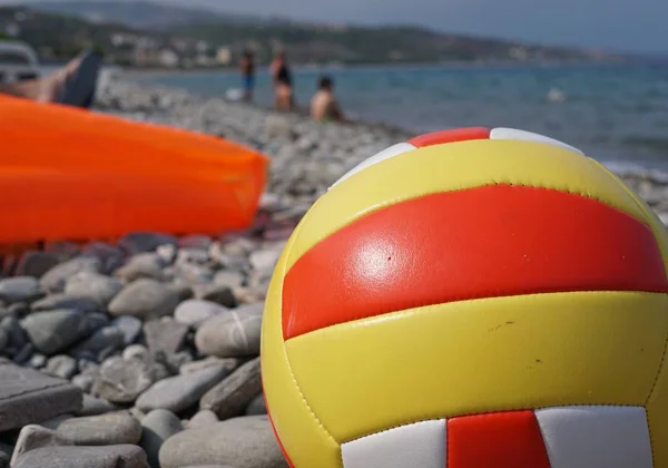Beach volley ball on a stone beach