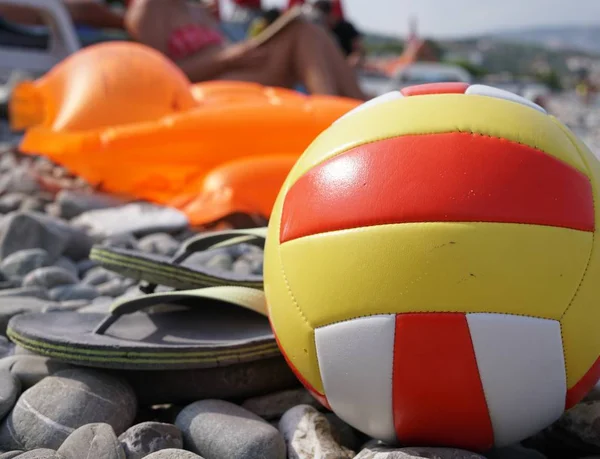 Beach volley ball on a stone beach