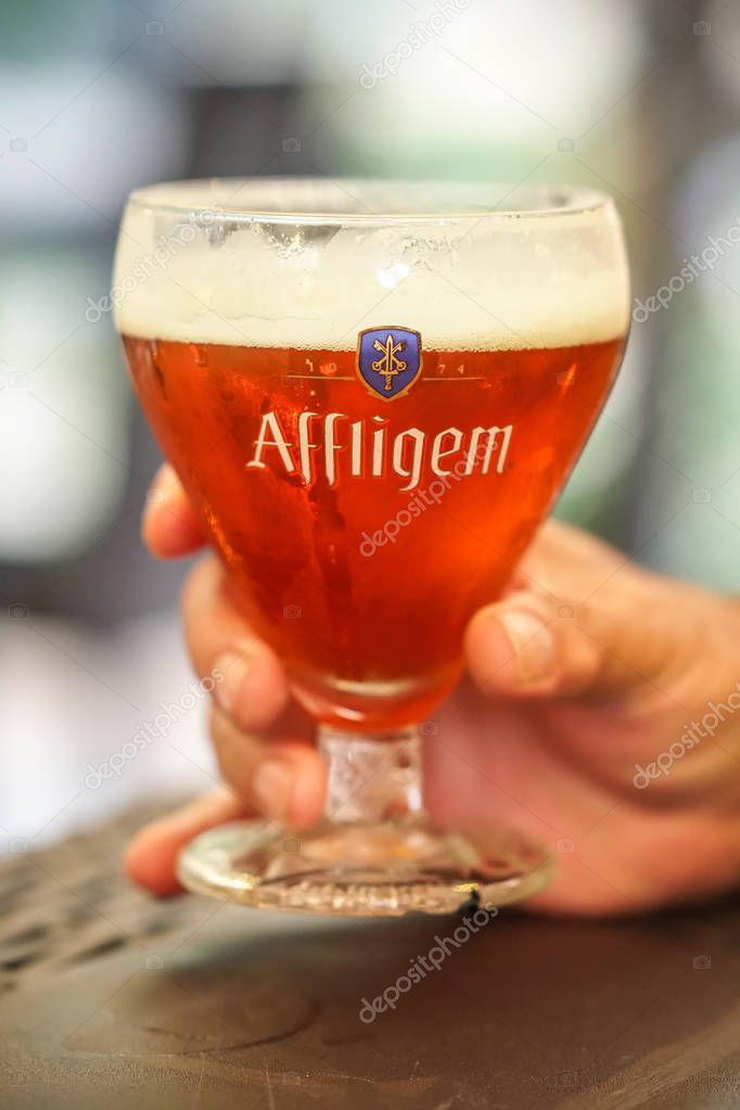 Berlin, Germany - September 4, 2018: Glass full of Affligem abbey rouge beer, made by the Heineken-owned Affligem Brewery