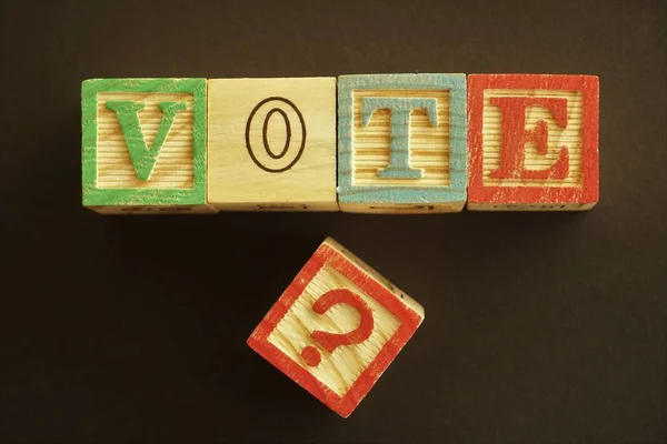 Political Disillusionment Wooden Cubes Representing Capital Letters Forming Word Vote — Stock Photo, Image