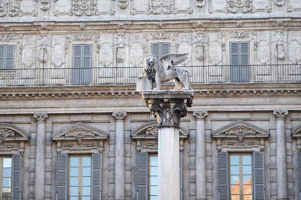 Statue of the winged Lion of Saint Mark above the marble column in piazza Erbe, Verona, Italy