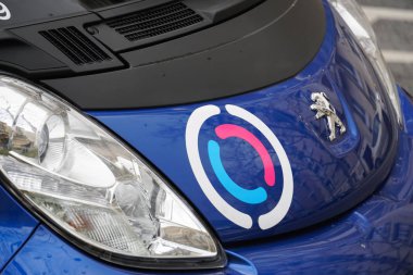 Paris, France - March 18, 2019: Free2Move Paris advertisement. Groupe PSA launched a carsharing service providing access to a fleet of 550 electric Peugeot i0n and Citron C-Zro vehicles clipart
