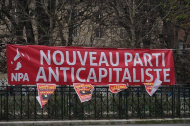 Paris, France - March 19, 2019: Red banner of the French New Anticapitalist Party (Nouveau Parti anticapitaliste, NPA) clipart