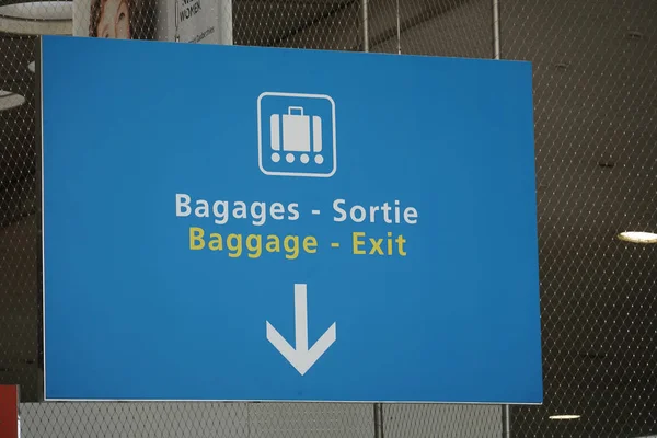 Bilingual signage: French Bagages - Sortie and English Baggage - Exit