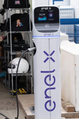 Berlin, Germany - May 25, 2019: Enel X electric charging station. Enel X Mobility is an Italian company Enel's subsidiary which aims to offer a platform of energy-related services clipart