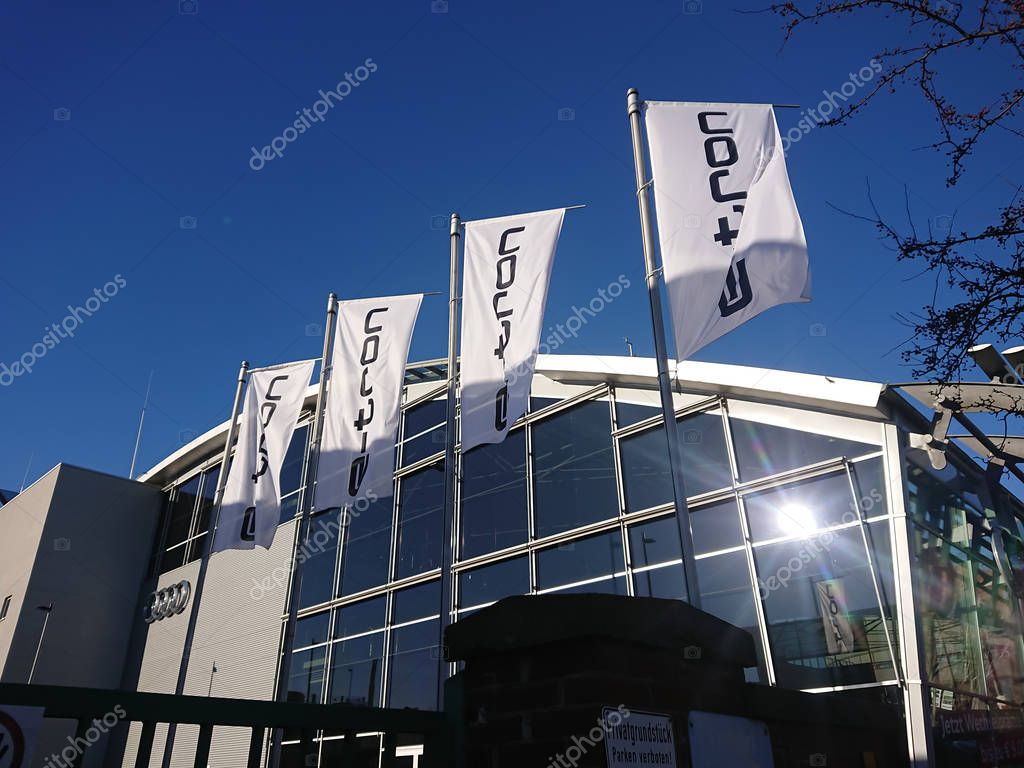 Berlin, Germany - February 24, 2019: E-tron flags outside an Audi car dealership. The Audi e-tron family is a series of electric and hybrid concept cars shown by Audi from 2009 onwards