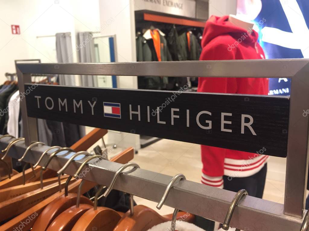 Berlin, Germany - October 11, 2018: Tommy Hilfiger sign. Tommy Hilfiger Corporation is a manufacturer of clothing. It produces and sells sporting men's and women clothing