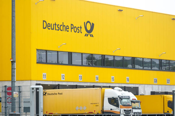 Berlin, Germany - July 30, 2019: Logistics center of the German Deutsche Post. Headquartered in Bonn, Deutsche Post DHL Group, is a German courier company and the world's largest