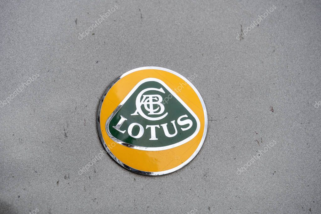Rome, Italy - August 12, 2019: Lotus Cars symbol on the front of a grey car. Lotus Cars is a British automotive company that manufactures sports cars and racing cars