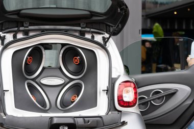 Berlin, Germany - May 25, 2019: JBL Electric amplifier in a vehicle clipart