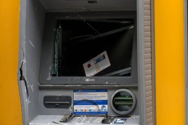 Frankfurt am Main, Germany - June 28, 2020: Smashed and abandoned cash dispenser clipart