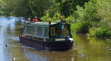 ST IVES, CAMBRIDGESHIRE, ENGLAND - MAY 28, 2020: Canal Boat on the river Ouse at St Ives Cambridgeshire. clipart