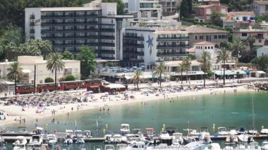 Seafront at Perto de Soller Mallorca with tram moving along left to right