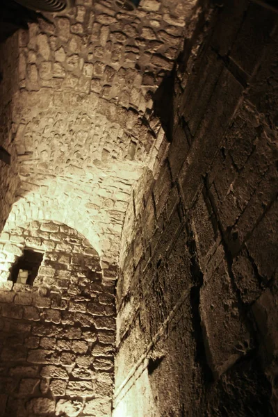 Dungeons of the Temple Mount. Israel, Jerusalem: the remains of the second Jerusalem temple are preserved in the dungeons of the temple mountain. Gloomy atmosphere, massive masonry.