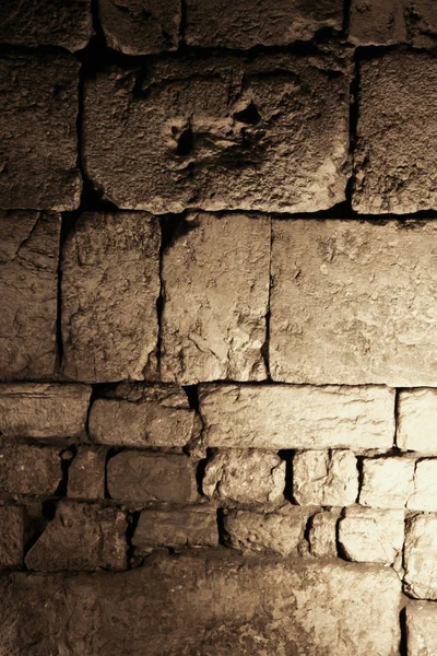 The Wailing Wall from the inside. Dungeons of the Temple Mount. Israel, Jerusalem: the remains of the second Jerusalem temple are preserved in the dungeons of the temple mountain. Gloomy atmosphere, massive masonry.