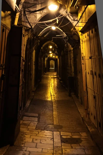 Vaults of the cave street. Dark nightly narrow streets of the old city, Israel, Jerusalem