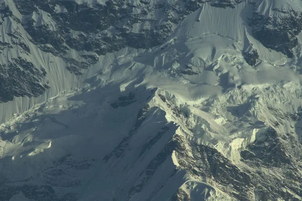 Snowy precipices of southern Annapurna. Trekking to Annapurna Base Camp, Nepal.