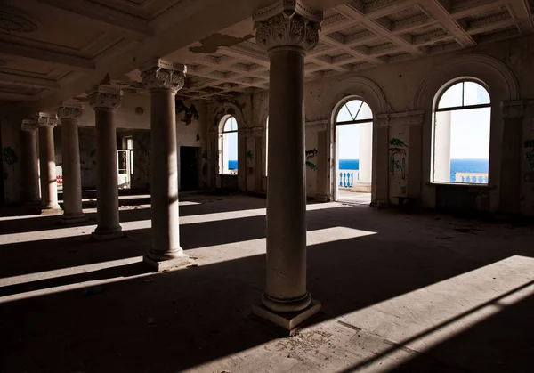 the ruins of the hotel, the empty hall of the shadow of the windows and columns. Gagripsh, Abkhazia