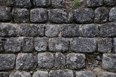 Antik kasvetli duvar gri taş, taş işçiliği, arka plan.