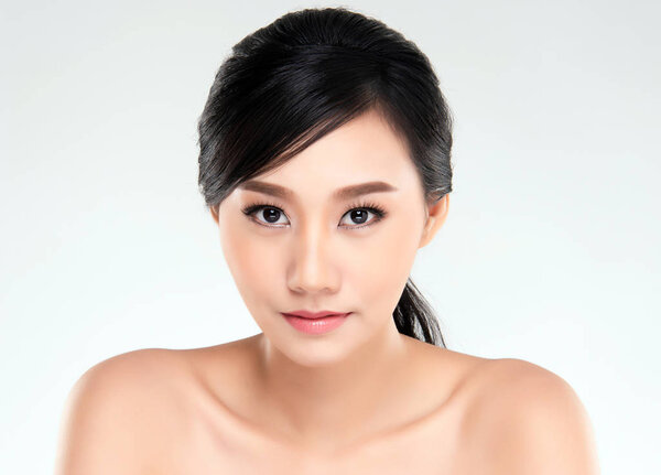 Beautiful Young Asian Woman with Clean Fresh Skin look away, Girl beauty face care. Facial treatment, Cosmetology, beauty and spa.