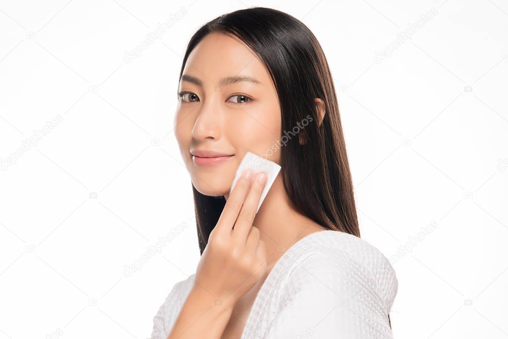 Beautiful Face of Young Woman with Clean Fresh Skin close up  on white. Beauty Portrait. Beautiful Spa Woman Smiling. Perfect Fresh Skin. Pure Beauty Model. Care Concept. cotton pad near face