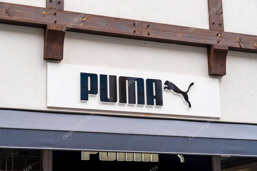 Cannock, Staffordshire, UK  September 9th 2025 Logo of Puma, a global sporting clothing brand on the side of an outlet store