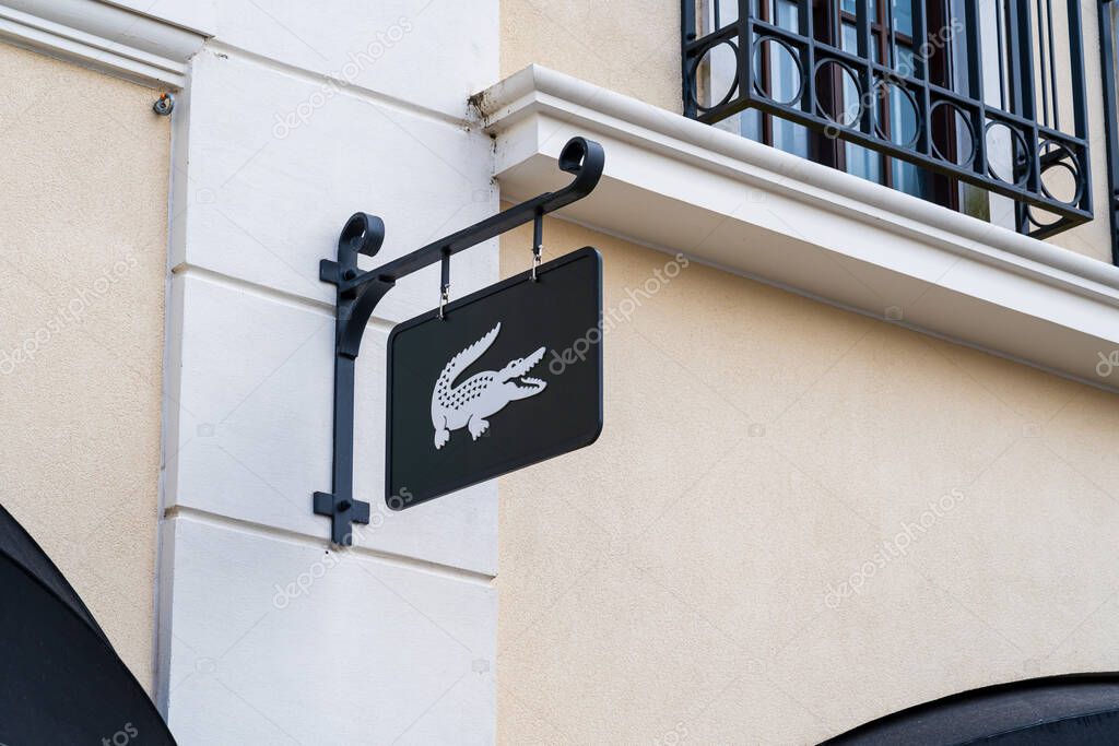 Cannock, Staffordshire, UK  September 9th 2025 Signboard of Lacoste, a global sportswear company at an outlet store