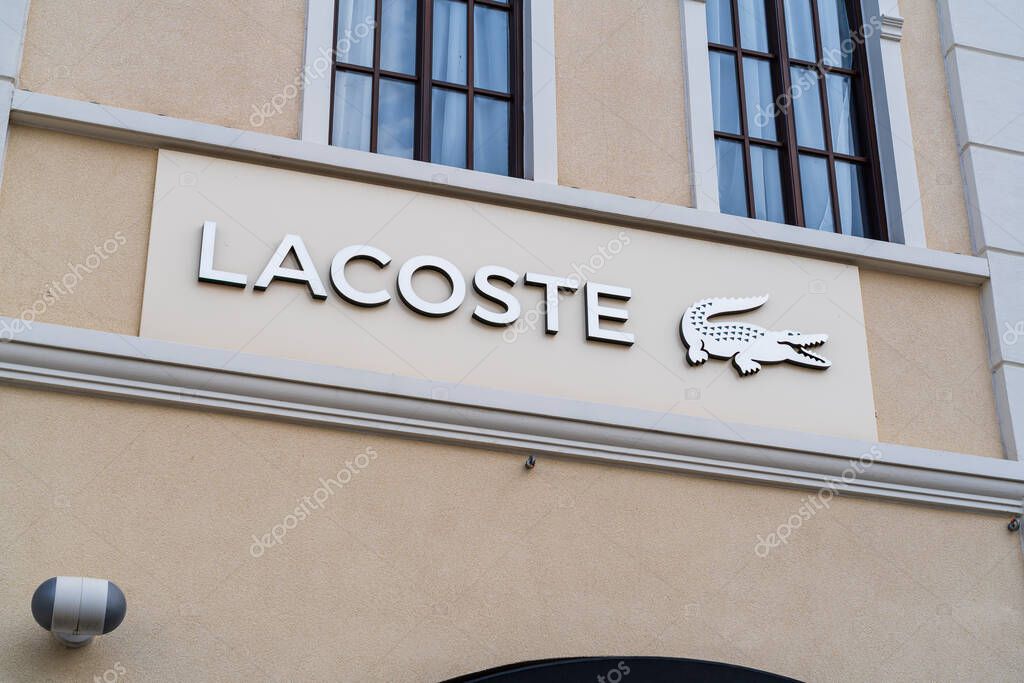 Cannock, Staffordshire, UK  September 9th 2025 Logo of Lacoste, a global sportswear company at an outlet store