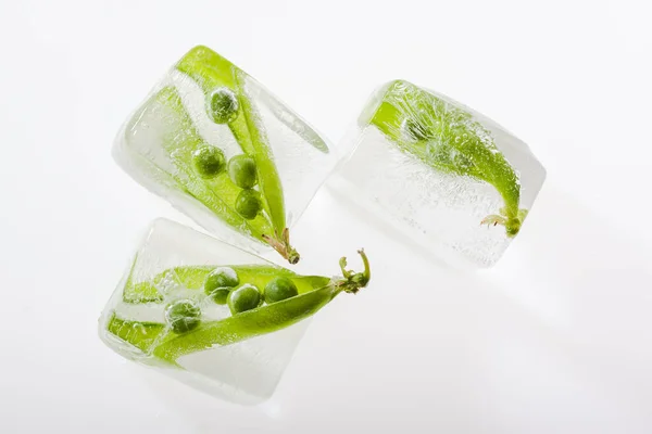 Top View Fresh Green Pea Pods Frozen Ice Cubes White — Stock Photo, Image