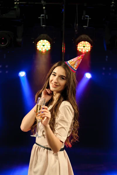 cheerful young company celebrates birthday in a nightclub.