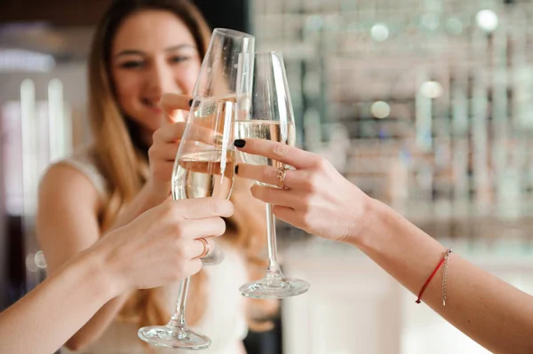 Group people with champagne dancing at the party