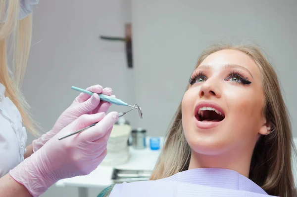 Young woman having medical checkup in the dentist office