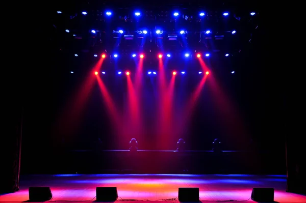 Free stage with lights, lighting devices. Night show.