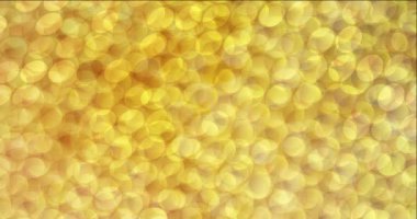 4K baloncuklu koyu sarı akış videosu.