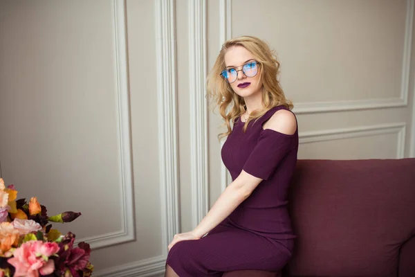 stock image the girl in a suit and glasses